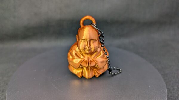 Caked Up Buddha - a goofy keychain