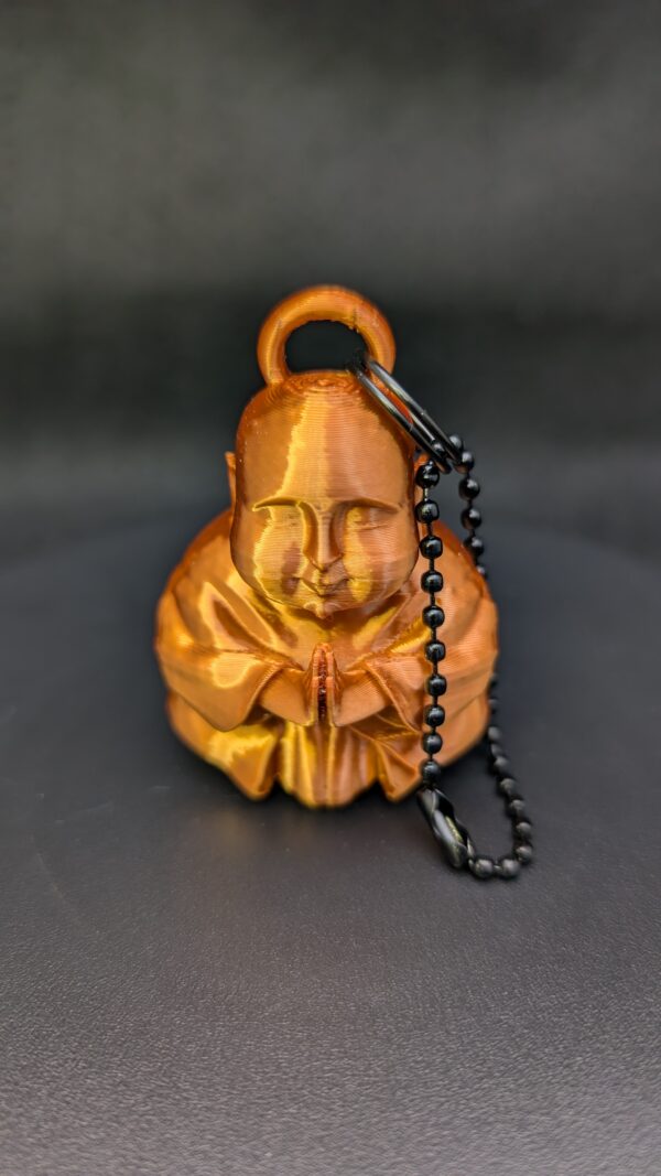 Caked Up Buddha - a goofy keychain