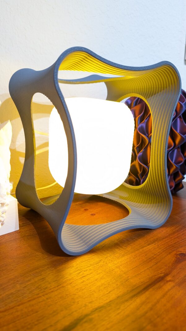 Hobbs Floating LED Desk Lamp – modern magnetic levitating light with circular design and warm ambient glow on desk setting