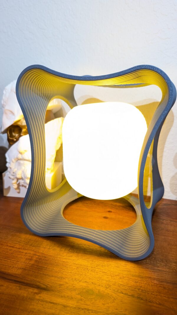 Hobbs Floating LED Desk Lamp – modern magnetic levitating light with circular design and warm ambient glow on desk setting