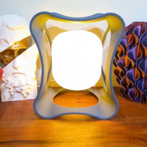 Hobbs Floating LED Desk Lamp – modern magnetic levitating light with circular design and warm ambient glow on desk setting