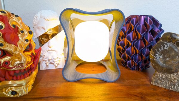 Hobbs Floating LED Desk Lamp – modern magnetic levitating light with circular design and warm ambient glow on desk setting